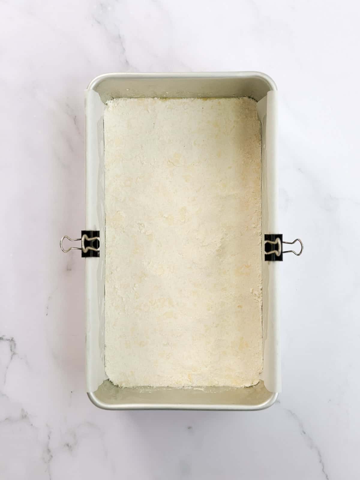 the crust pressed down into the bottom of the loaf pan.