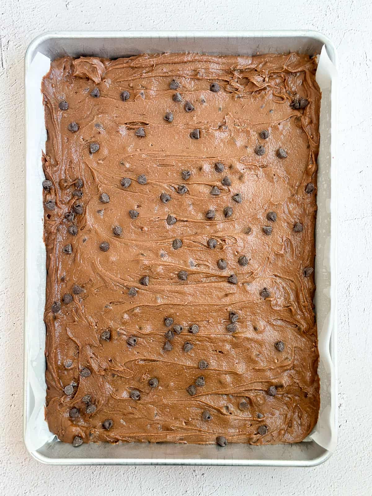 brownie batter in the pan before baking.