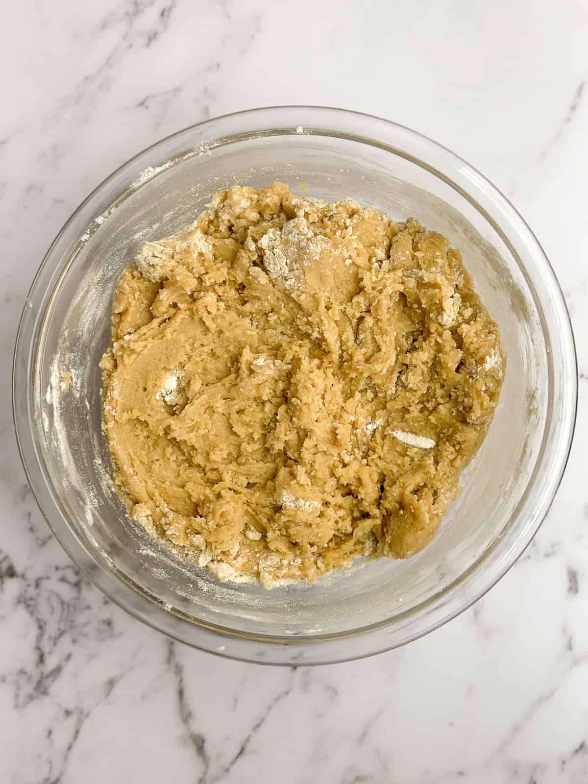 dry ingredients getting mixed in to the cookie dough.