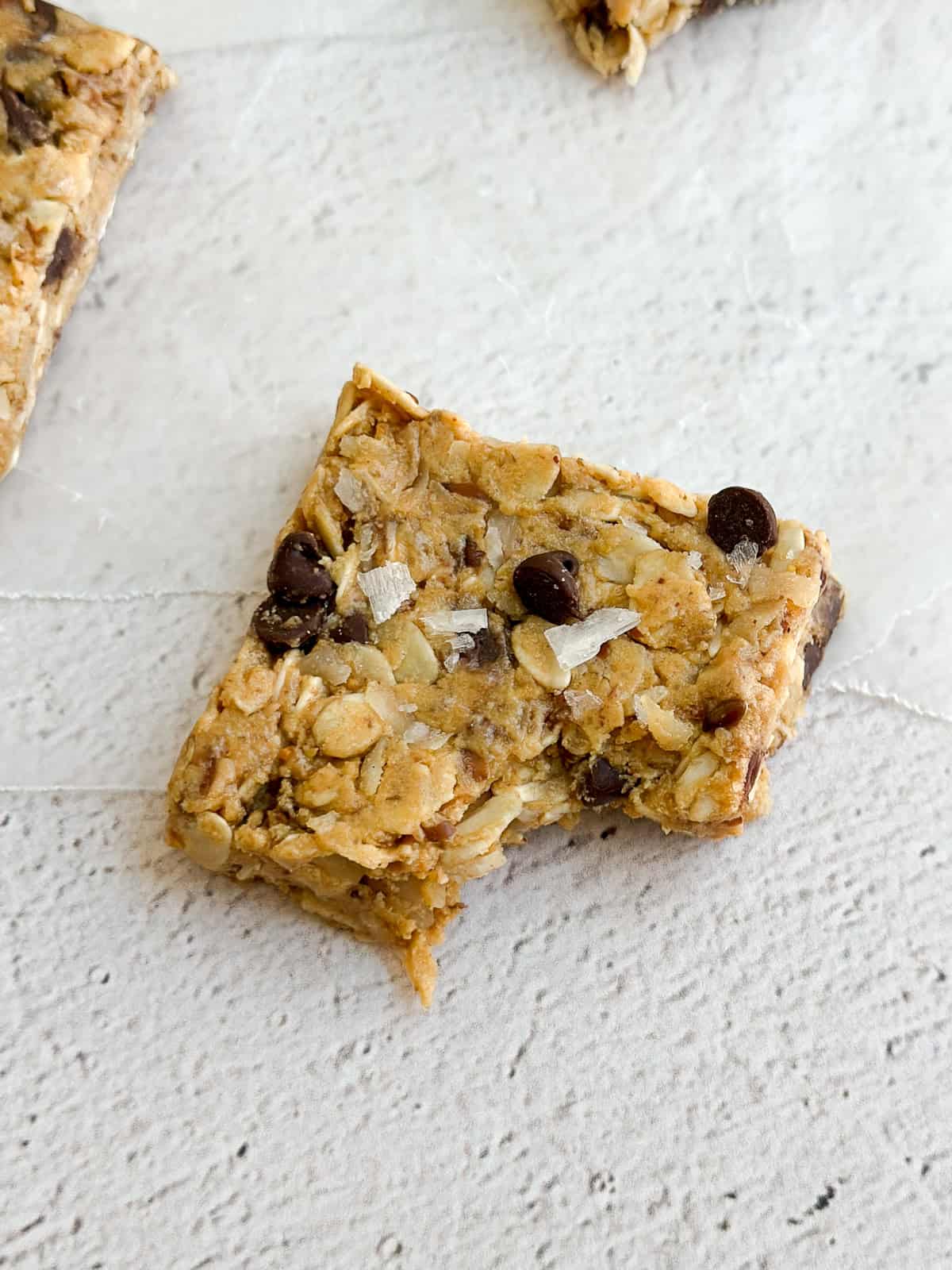 a close up of a single protein bar with a bite missing.