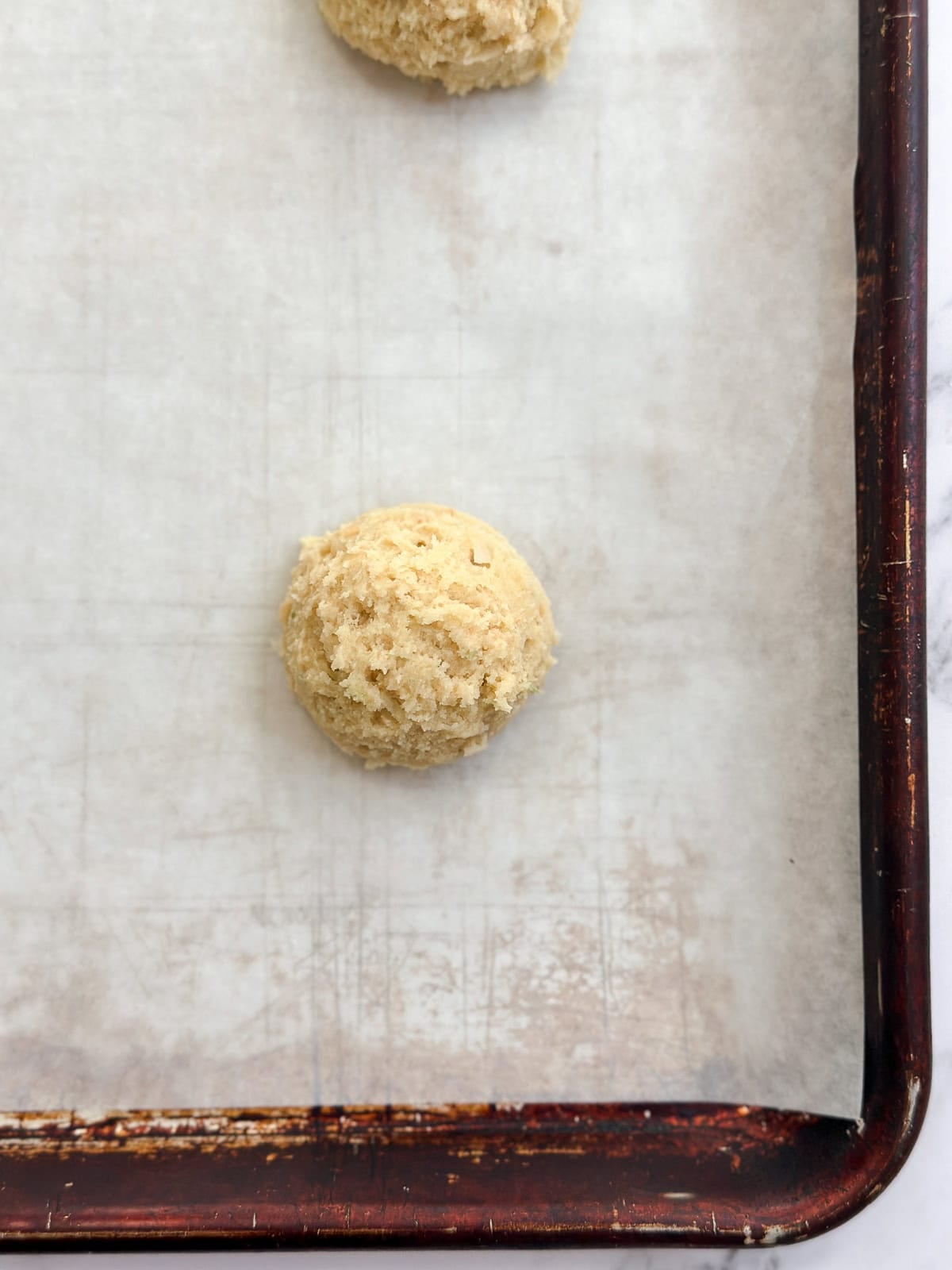 cookie dough balls before baking on the cookie sheet.