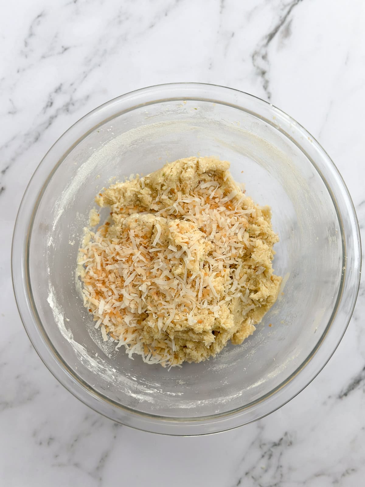 dry ingredients and coconut added to the dough.