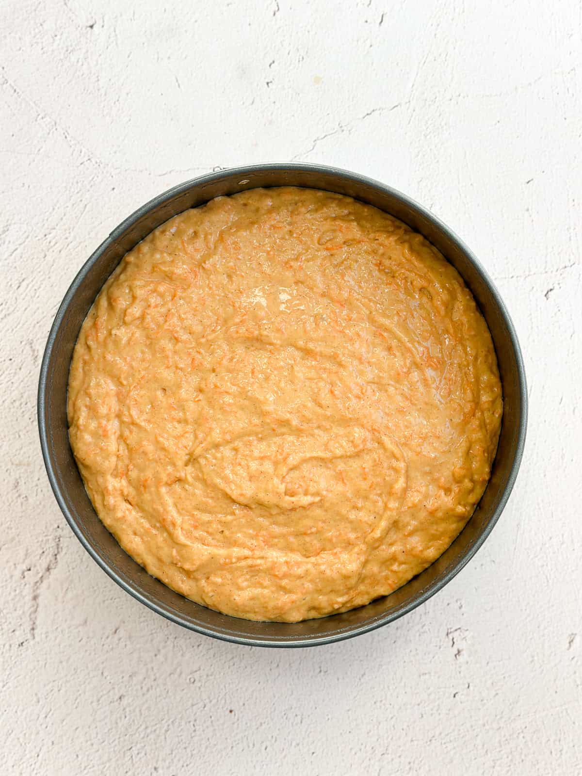 Carrot cake batter in the baking pan.