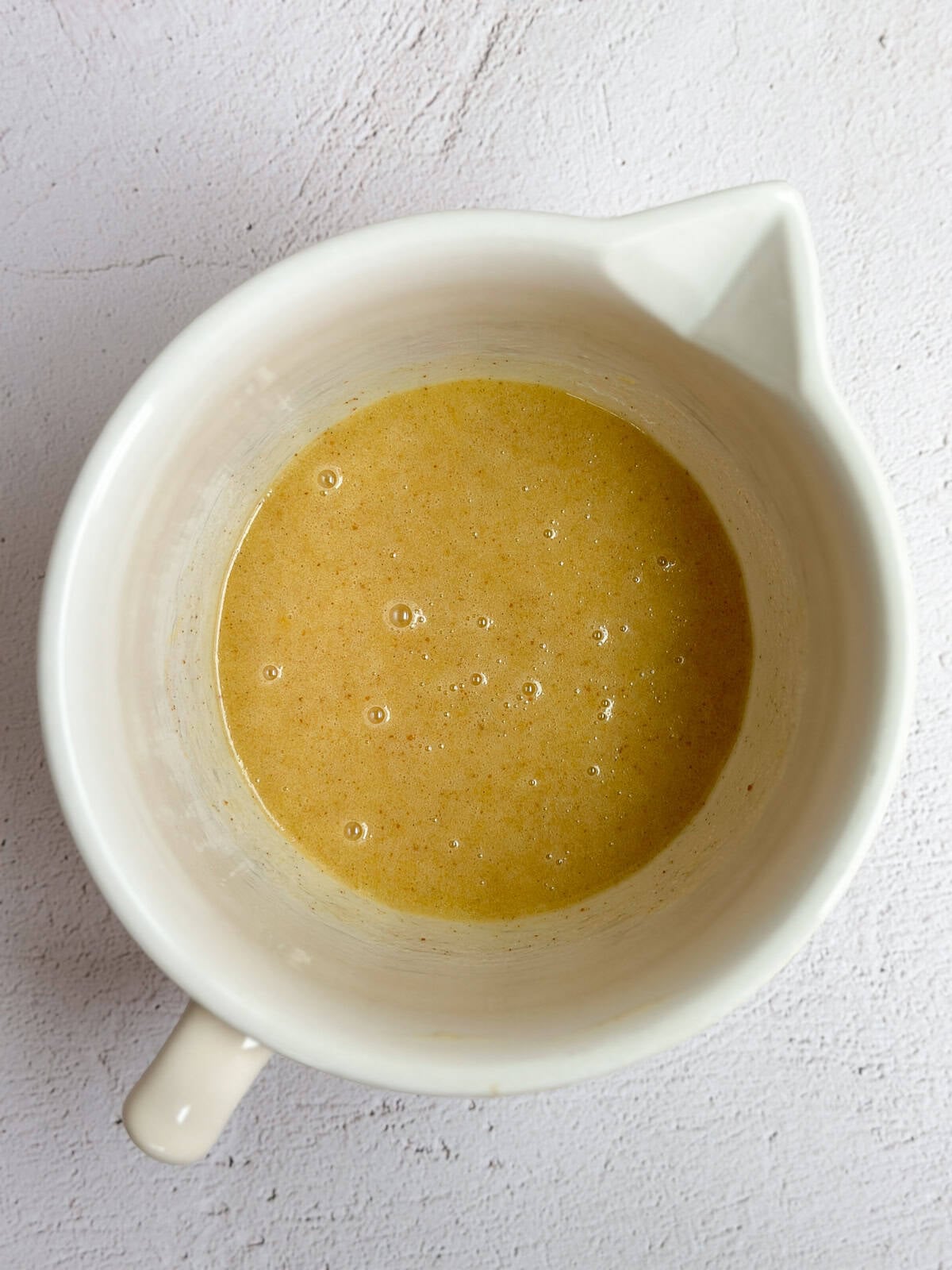 wet ingredients for the cake mixed together.