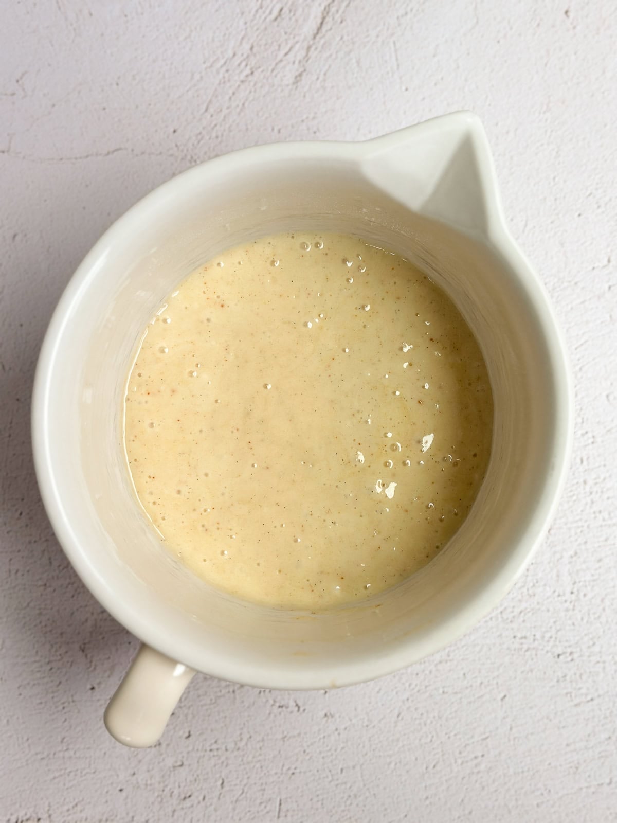 alternating the buttermilk and dry ingredients into the batter.