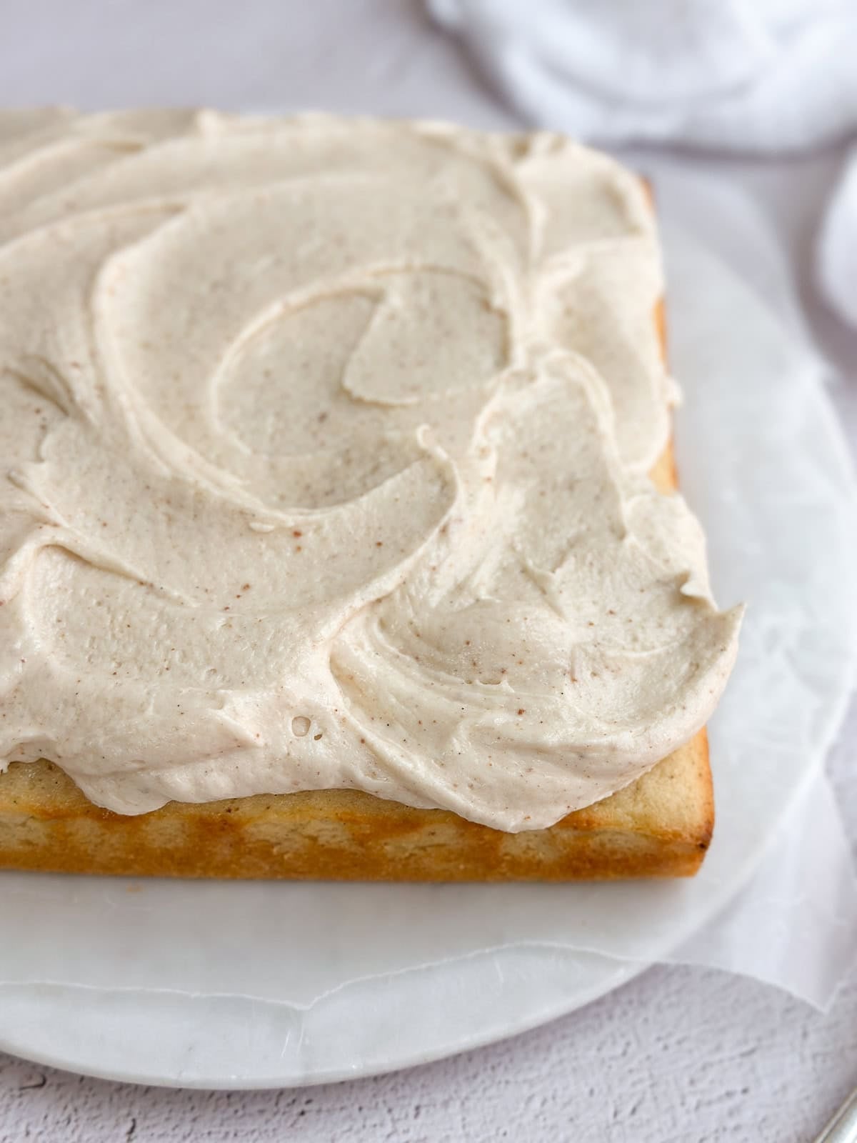 a side view of the brown butter cake to see the swirls of frosting.