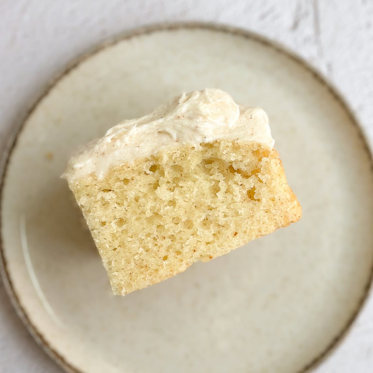 a single slice of brown butter cake on a plate.