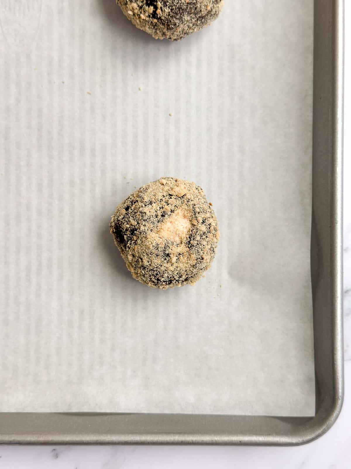 cookie dough in graham cracker crumbs before baking.