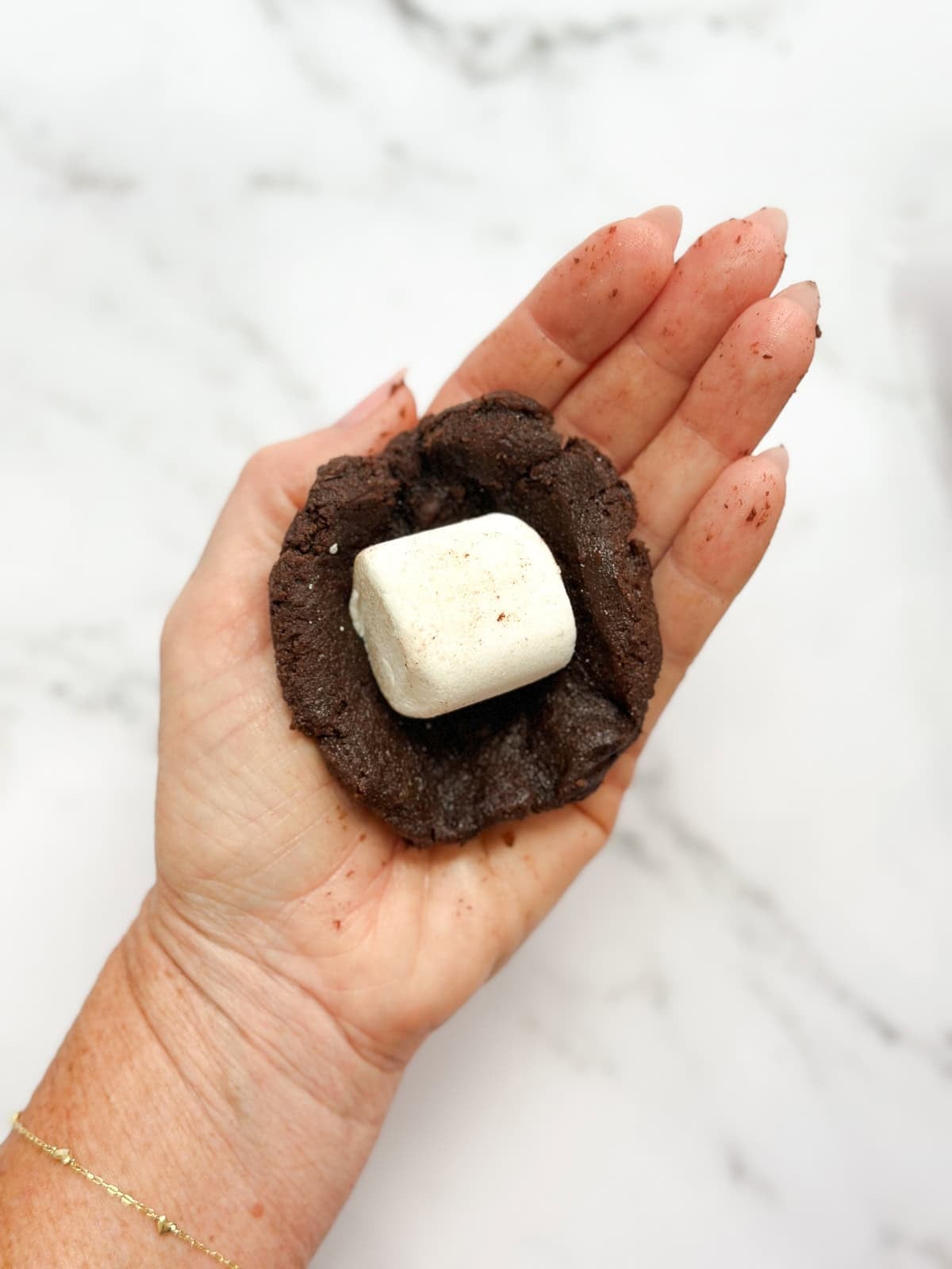 showing how to stuff the marshmallow.