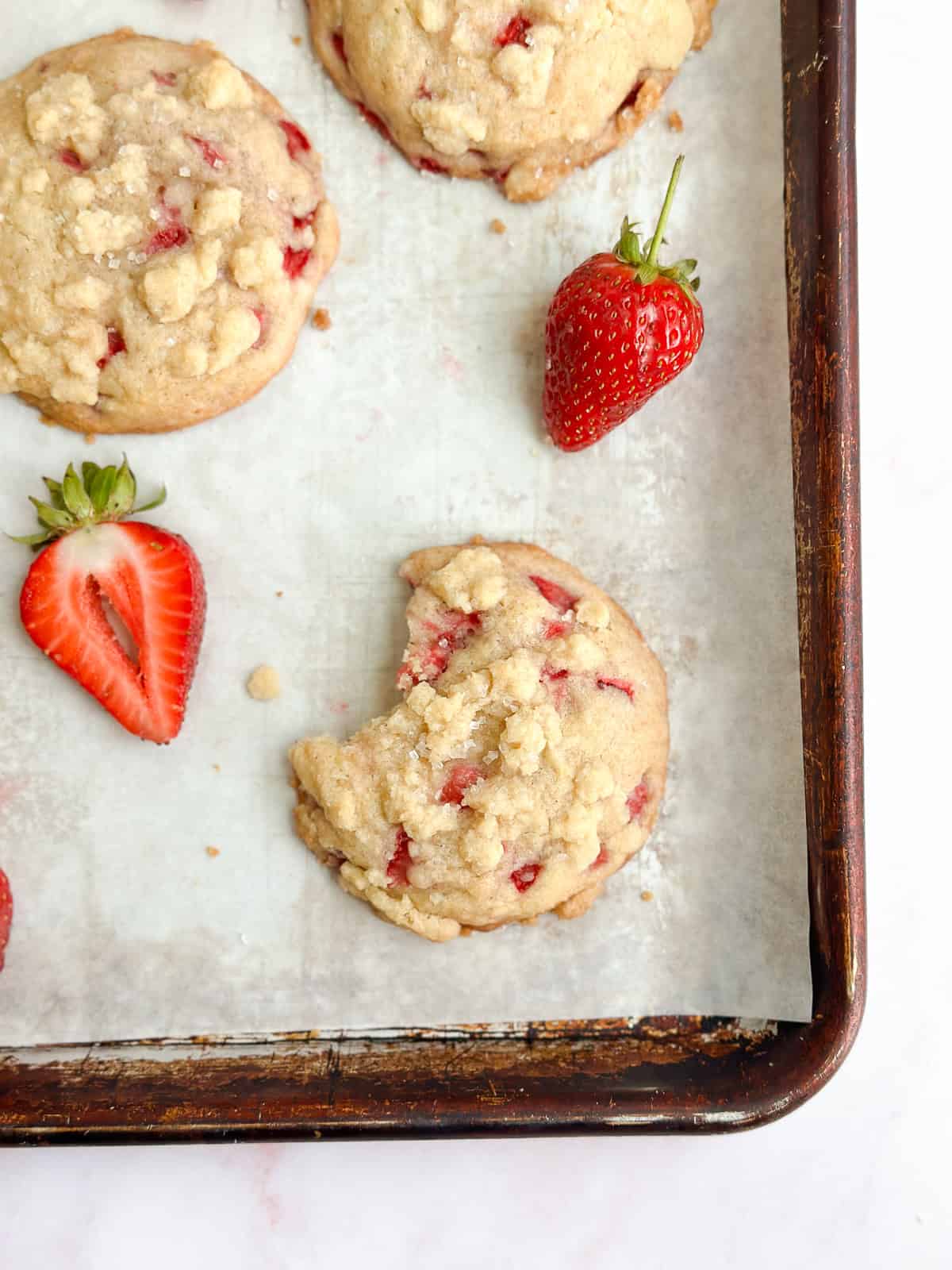 a close up of a few cookies on a cookie sheet.