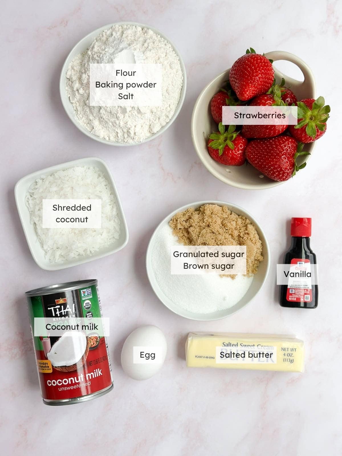 All of the ingredients needed to make coconut strawberry cake.