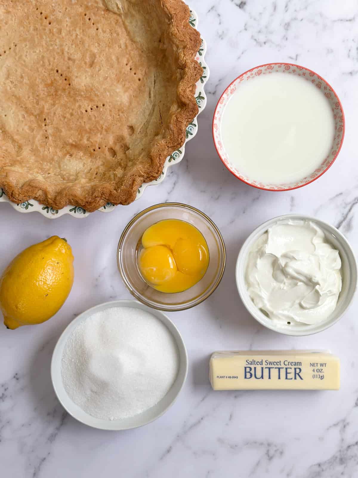all the ingredients needed to make this lemon sour cream pie.