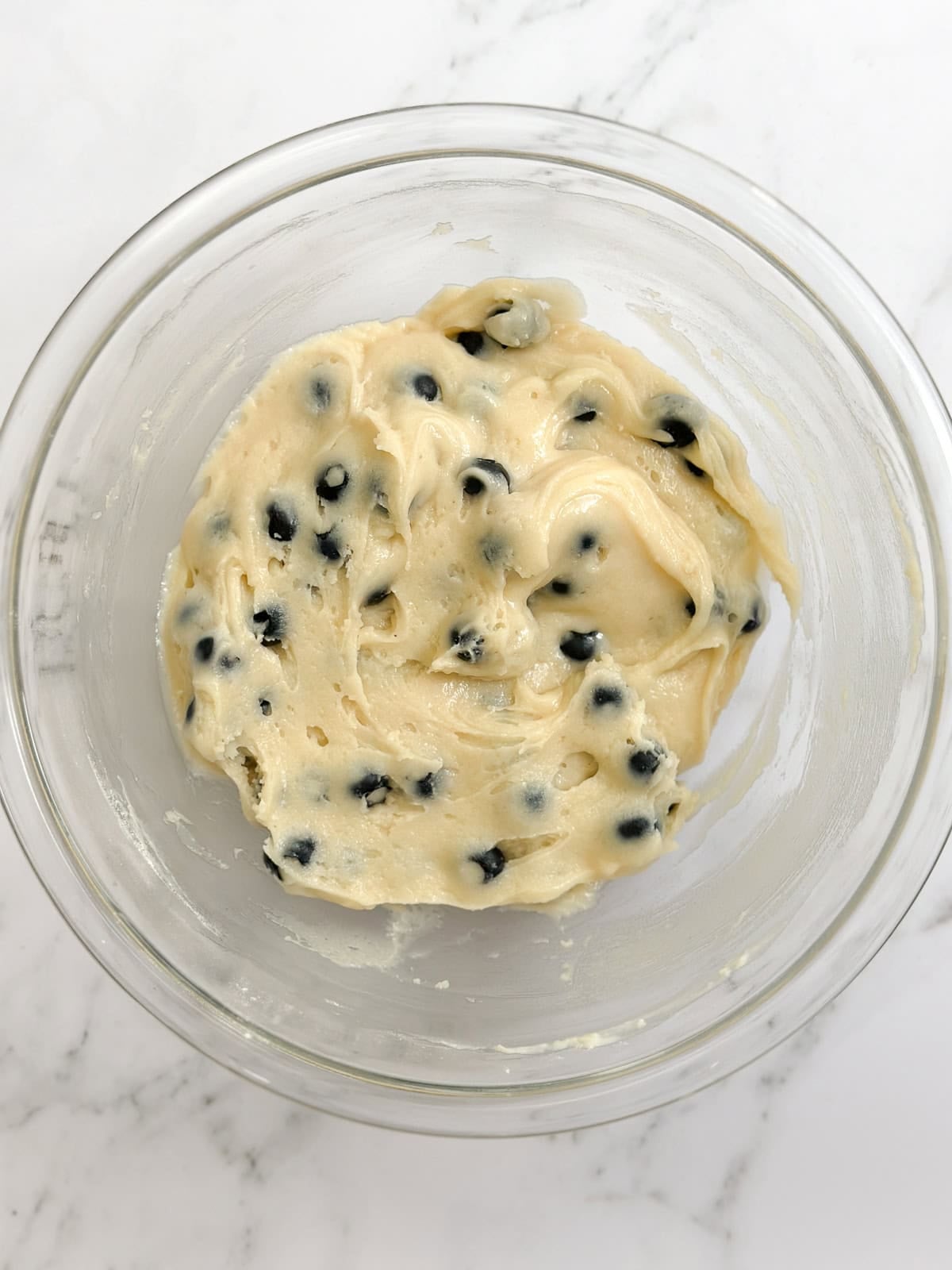 Blueberries added to the muffin batter.