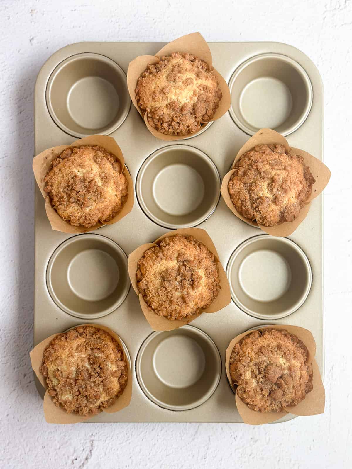 showing the muffins spaced in the pan.