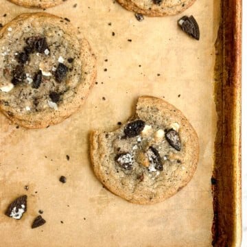 a cookies and cream cookie with a bite missing.