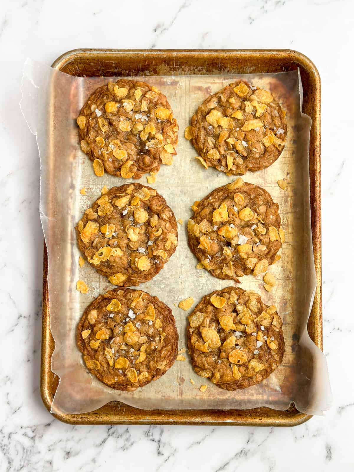 6 cookies on a cookie sheet.
