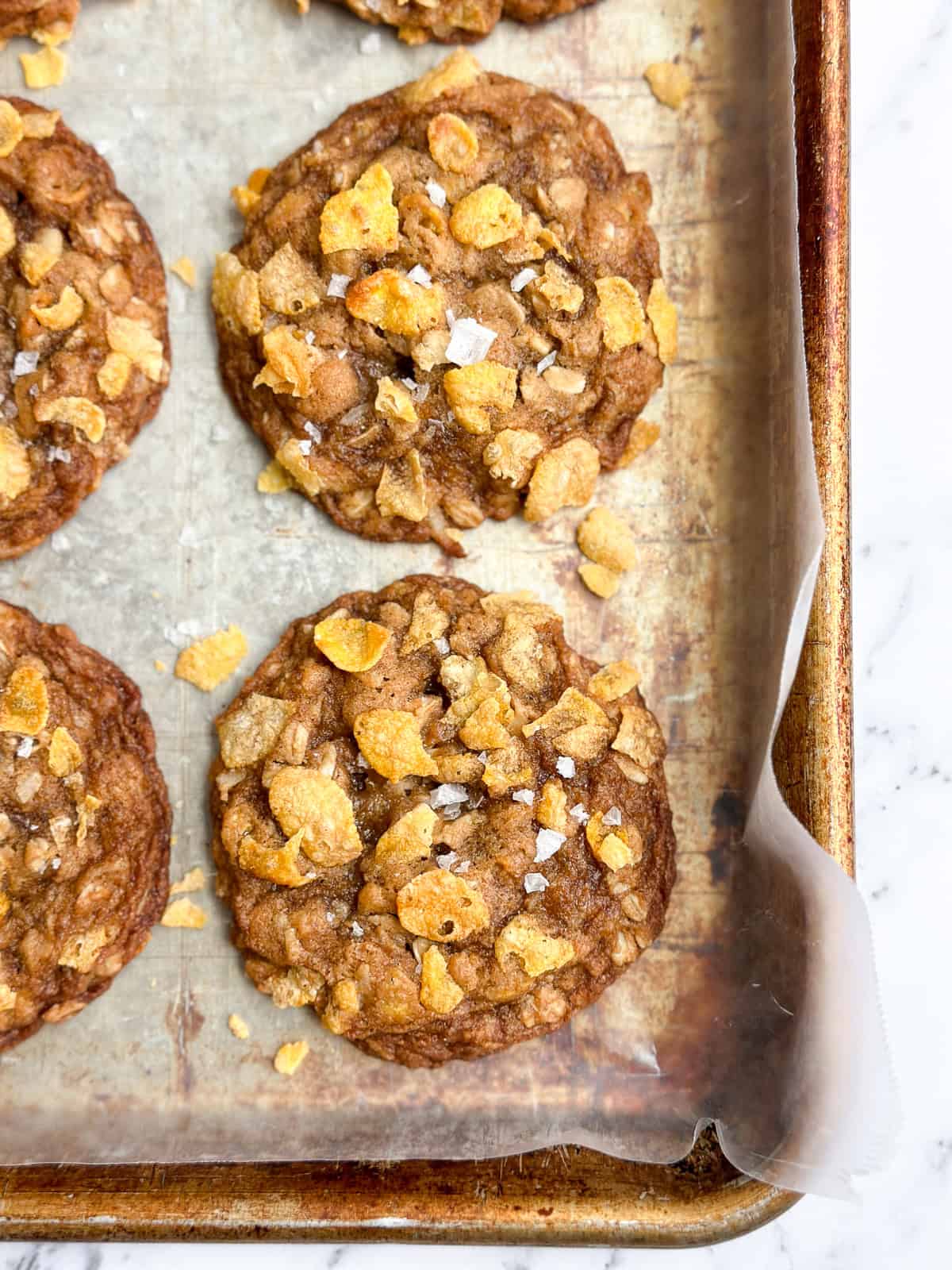 a closeup of a salted oatmeal cornflake cookie.