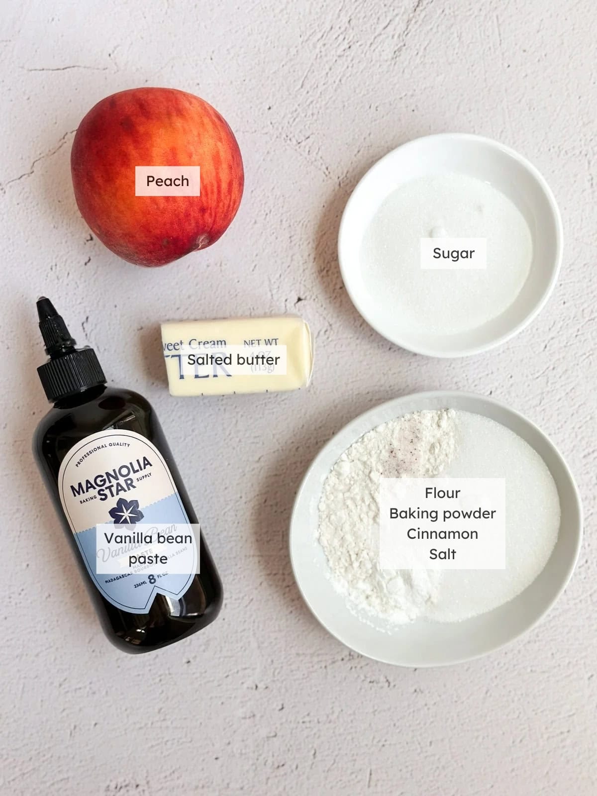 All of the ingredients needed to make mini peach cobblers for two.