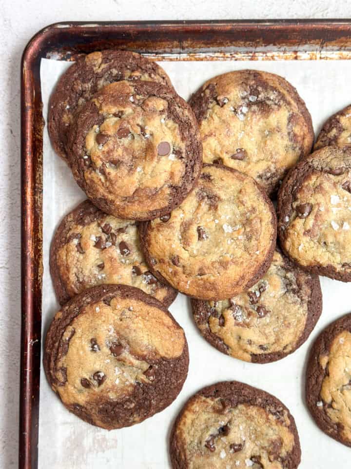 a bunch of brookies cookies stacked together on a cookie sheet.
