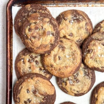 a bunch of brookies cookies stacked together on a cookie sheet.