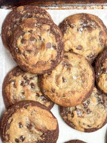 a bunch of brookies cookies stacked together on a cookie sheet.