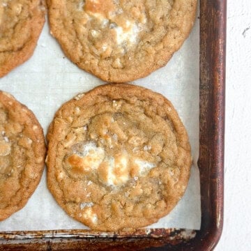 a few marshmallow crispy cookies (costco copycat) on a cookie sheet.