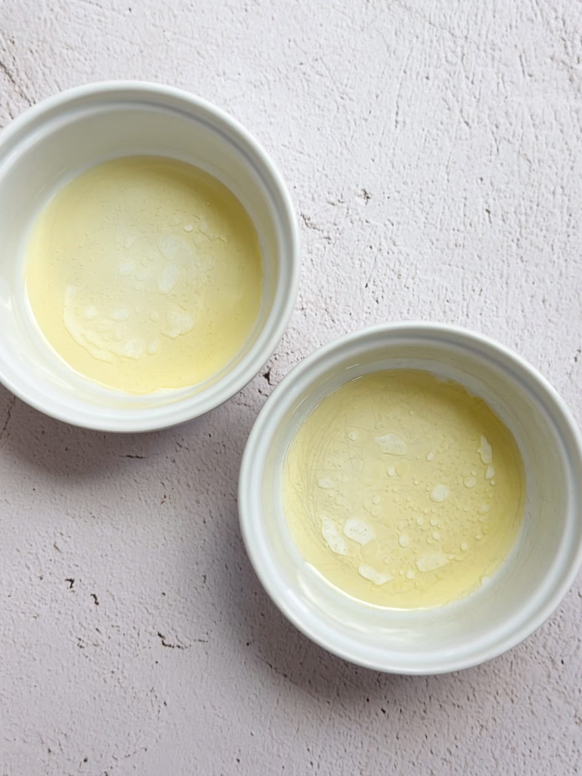 ramekins with melted butter in the bottom.