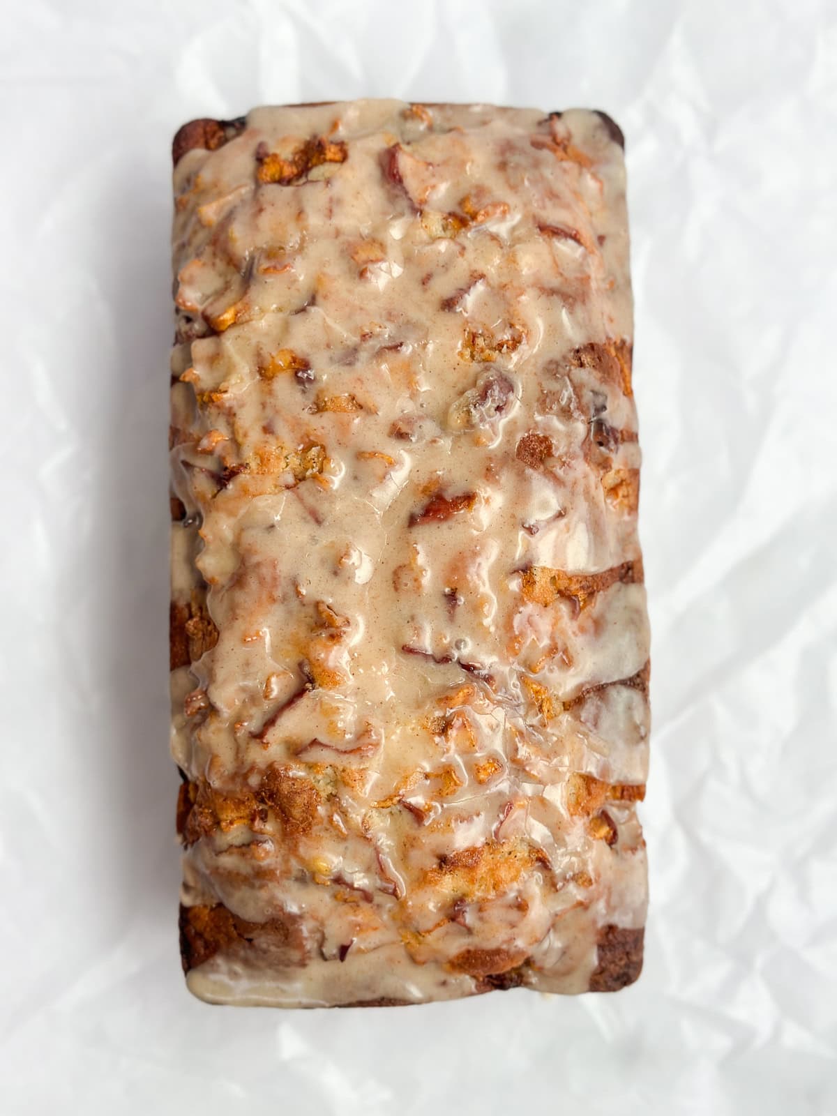 a close up of the whole peach loaf cake.