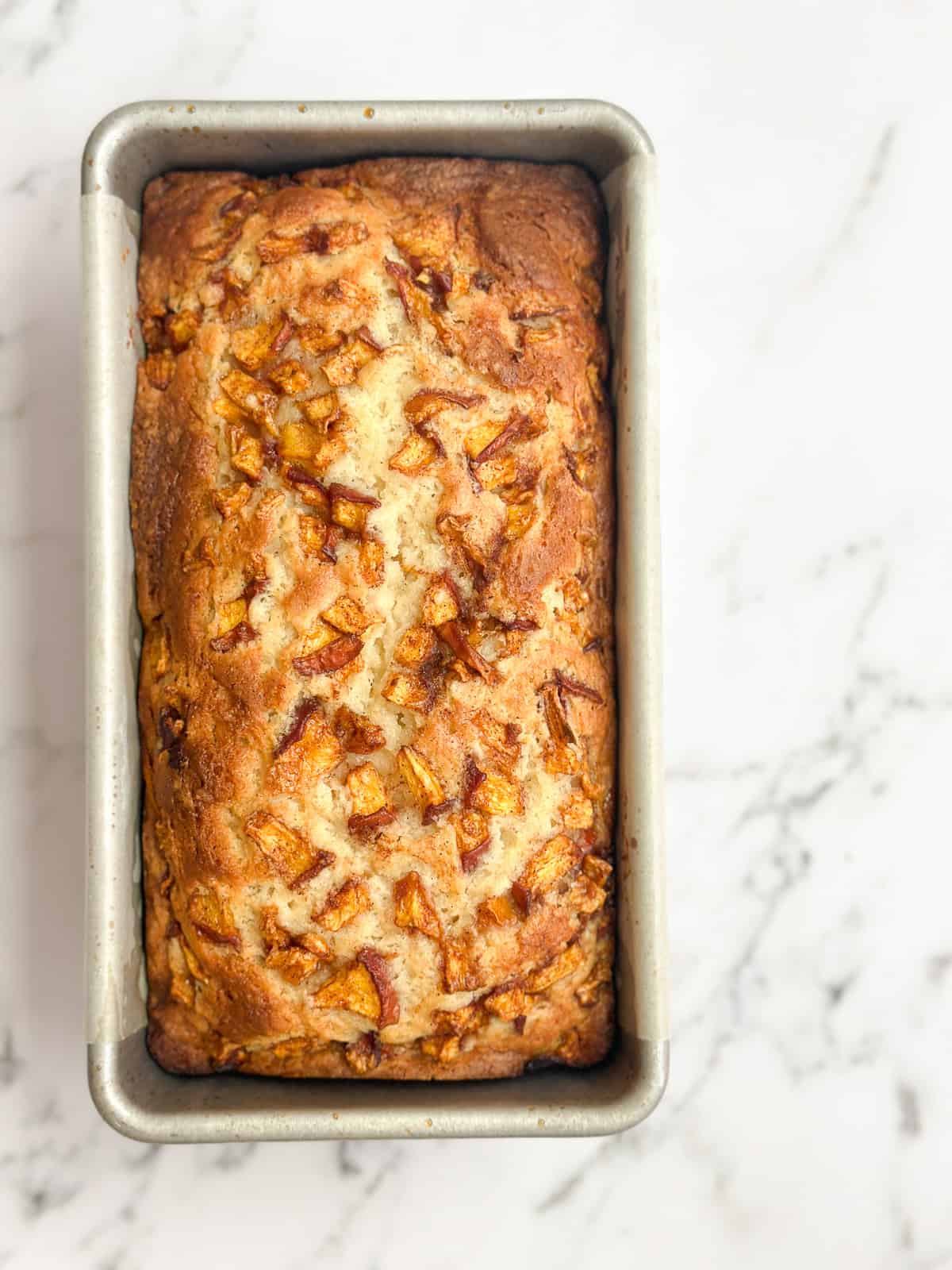 fresh peach loaf cake after baking.