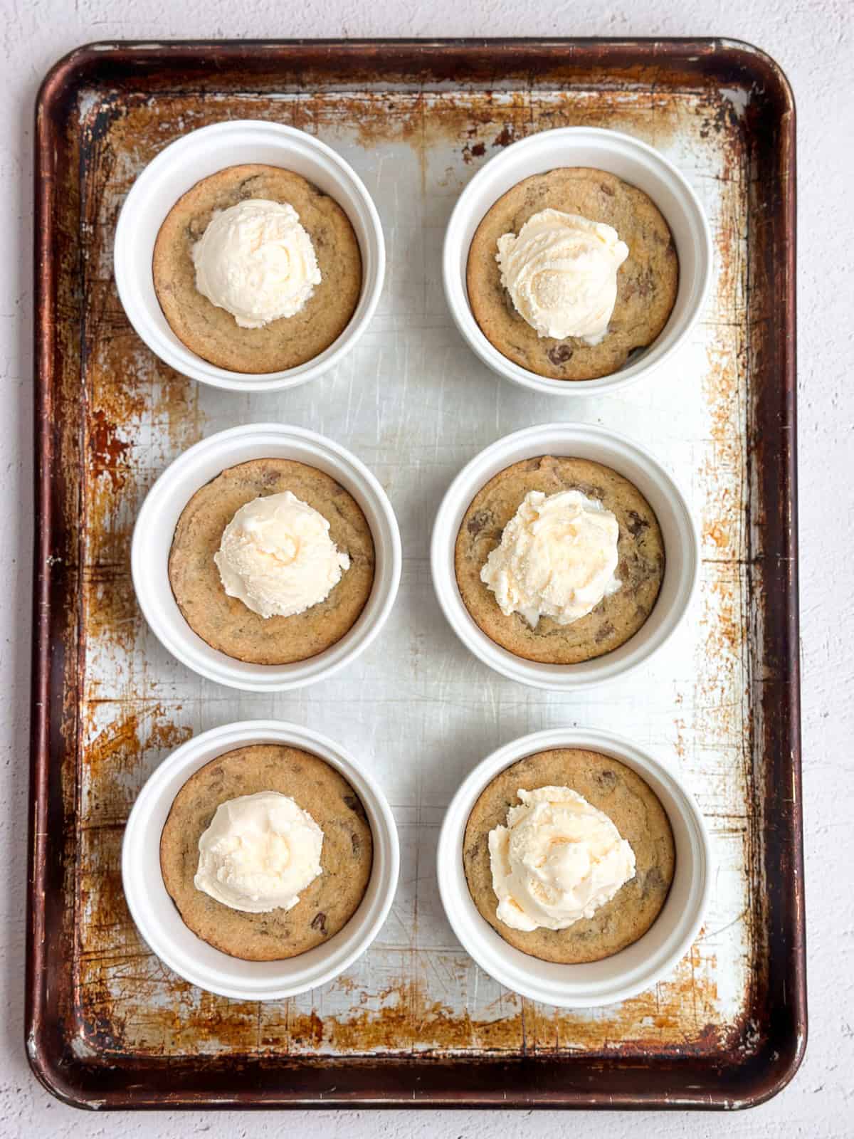 each cookie topped with ice cream, ready to eat!