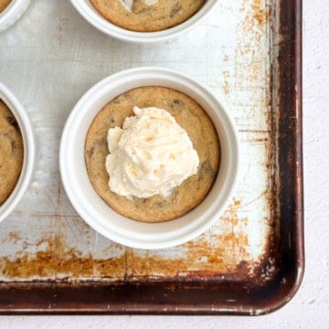mini chocolate chip cookie sundaes on a baking sheet.