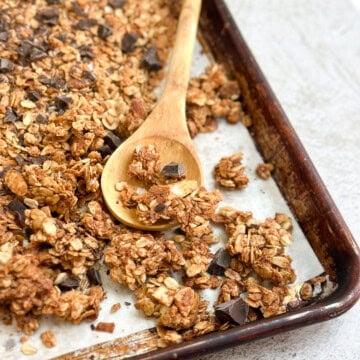 homemade peanut butter protein granola on a baking sheet after baking.