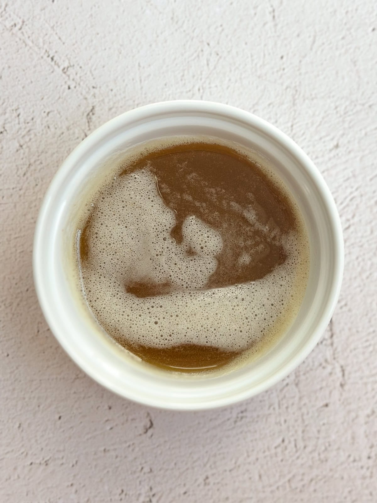 browned butter in a cup