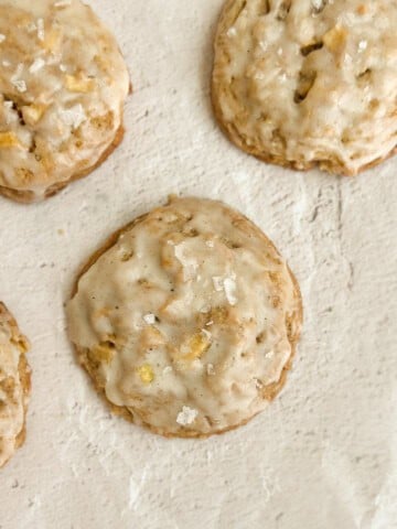 a few apple cinnamon cookies on some paper.
