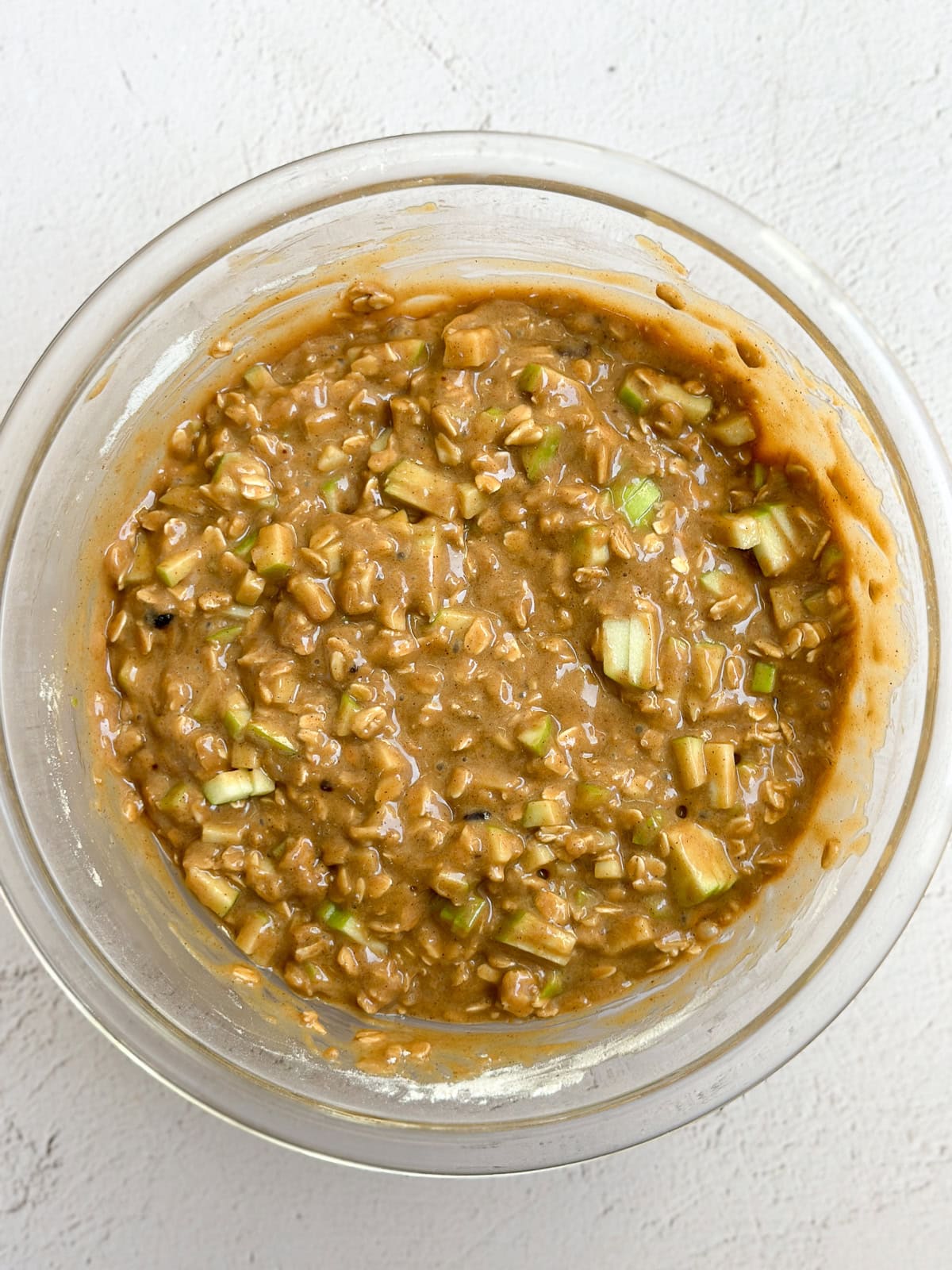 apples added into the muffin batter.