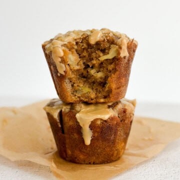 2 apple cinnamon oat muffins stacked on top of each other.