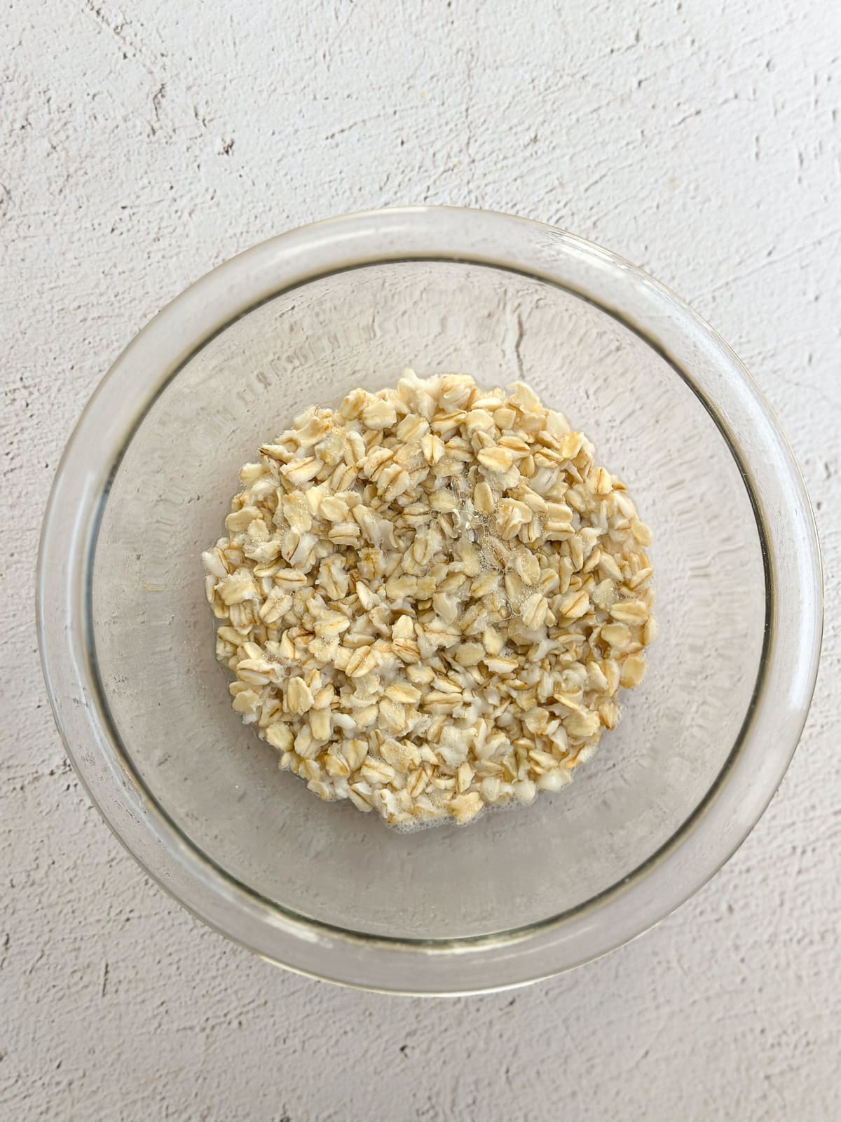 oats in a bowl where they have seeped up the water.