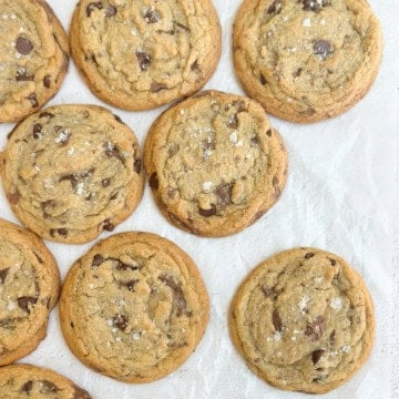 a bunch of brown butter chocolate chip cookies laying flat so you can see them all.