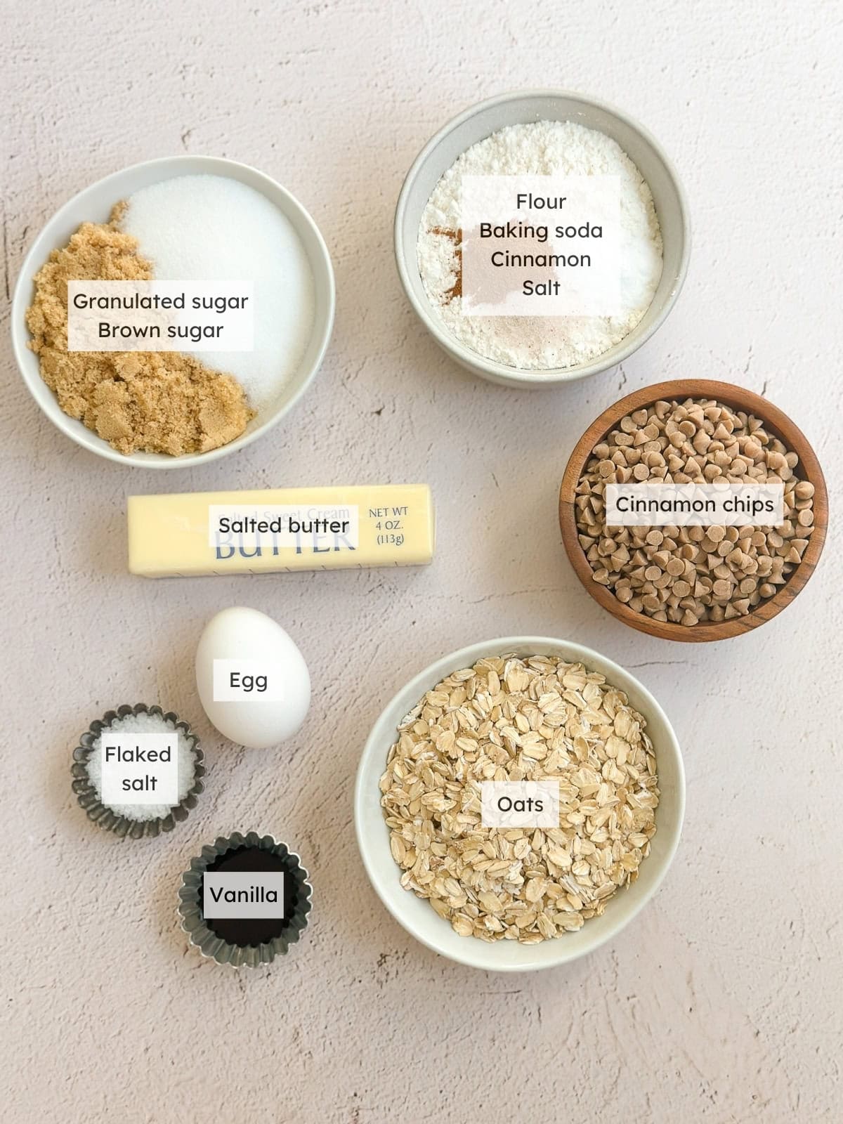 All of the ingredients needed to make cinnamon chip oatmeal cookies.