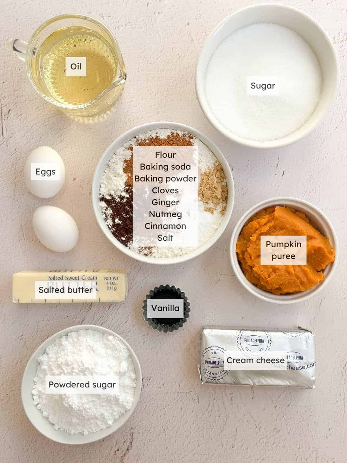 All of the ingredients needed to make pumpkin bars with cinnamon cream cheese frosting.