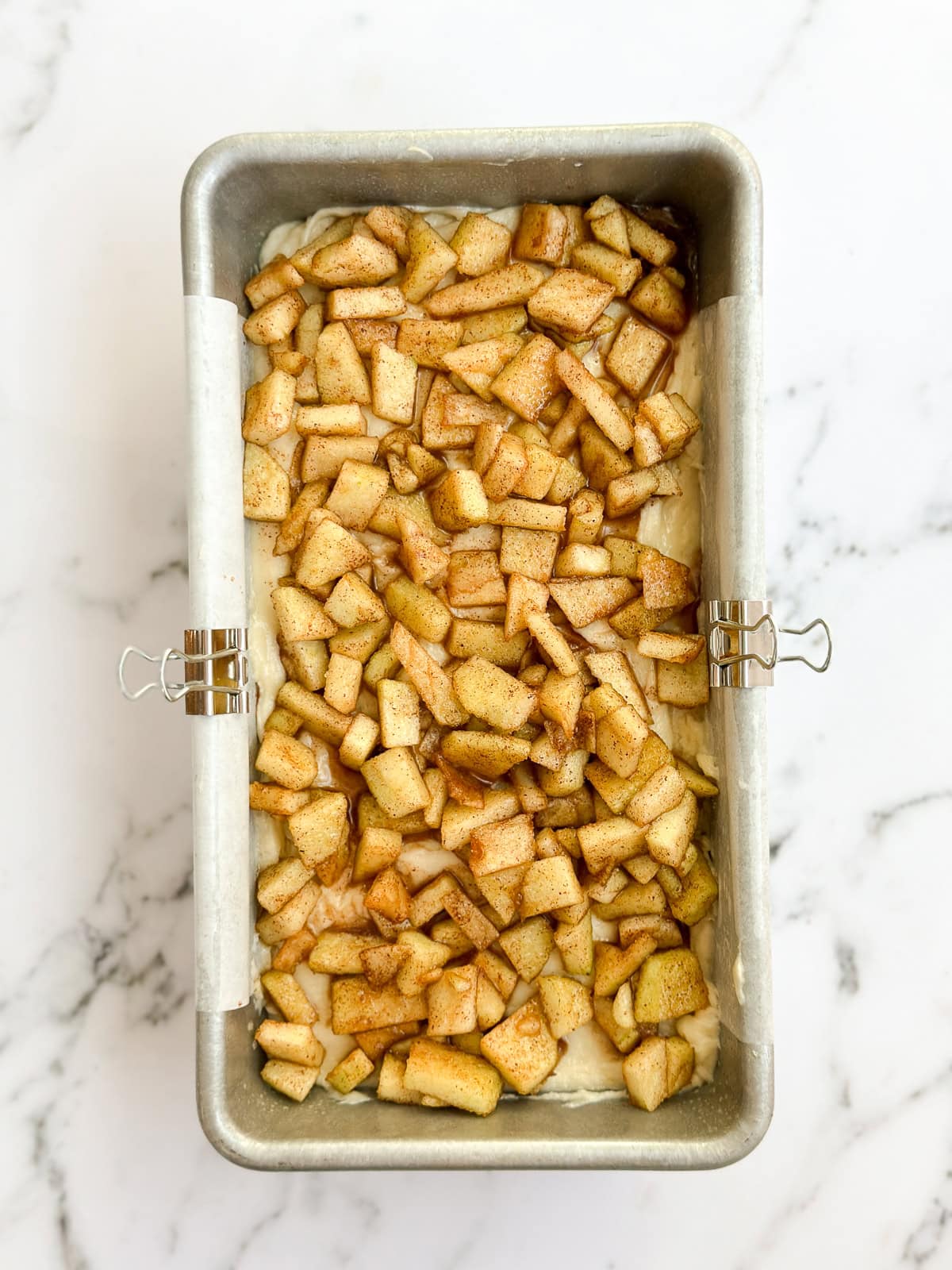 the apple fritter bread in the pan before baking.