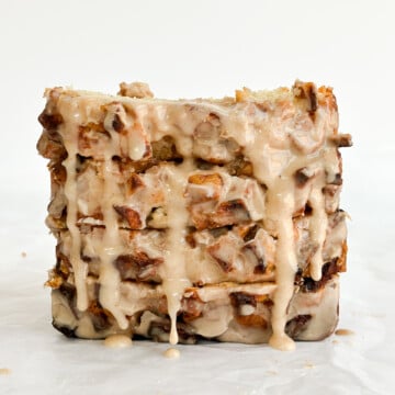 4 slices of easy apple fritter bread stacked together with an extra drizzle of glaze.