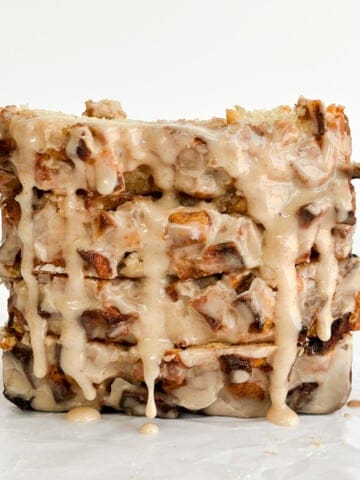 4 slices of easy apple fritter bread stacked together with an extra drizzle of glaze.