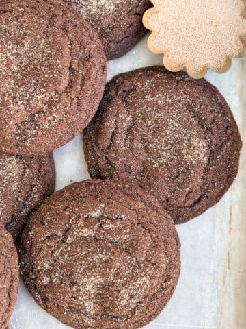 a few chocolate snickerdoodles stacked together.