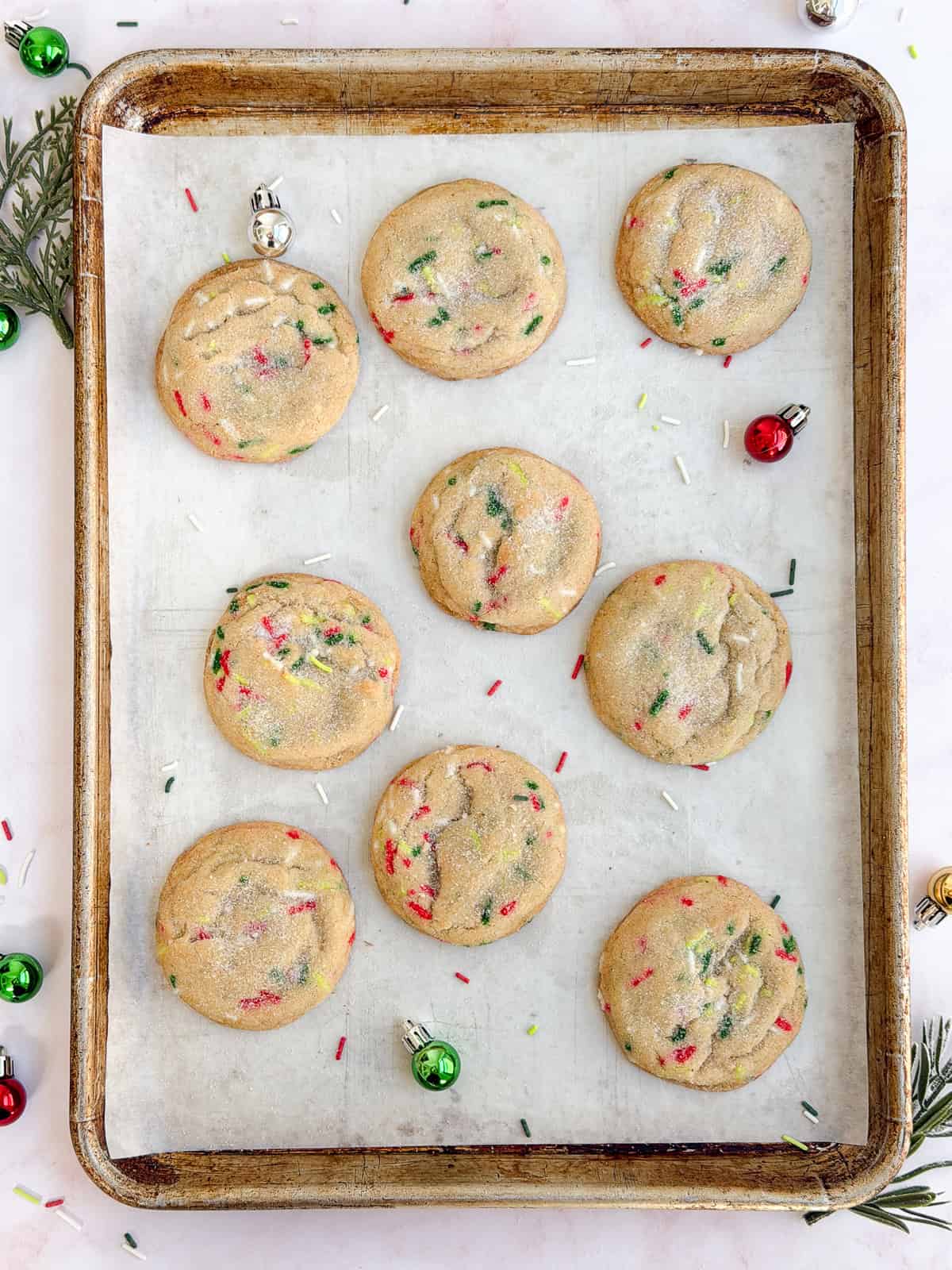 a full sheet pan of Christmas sprinkle sugar cookies.