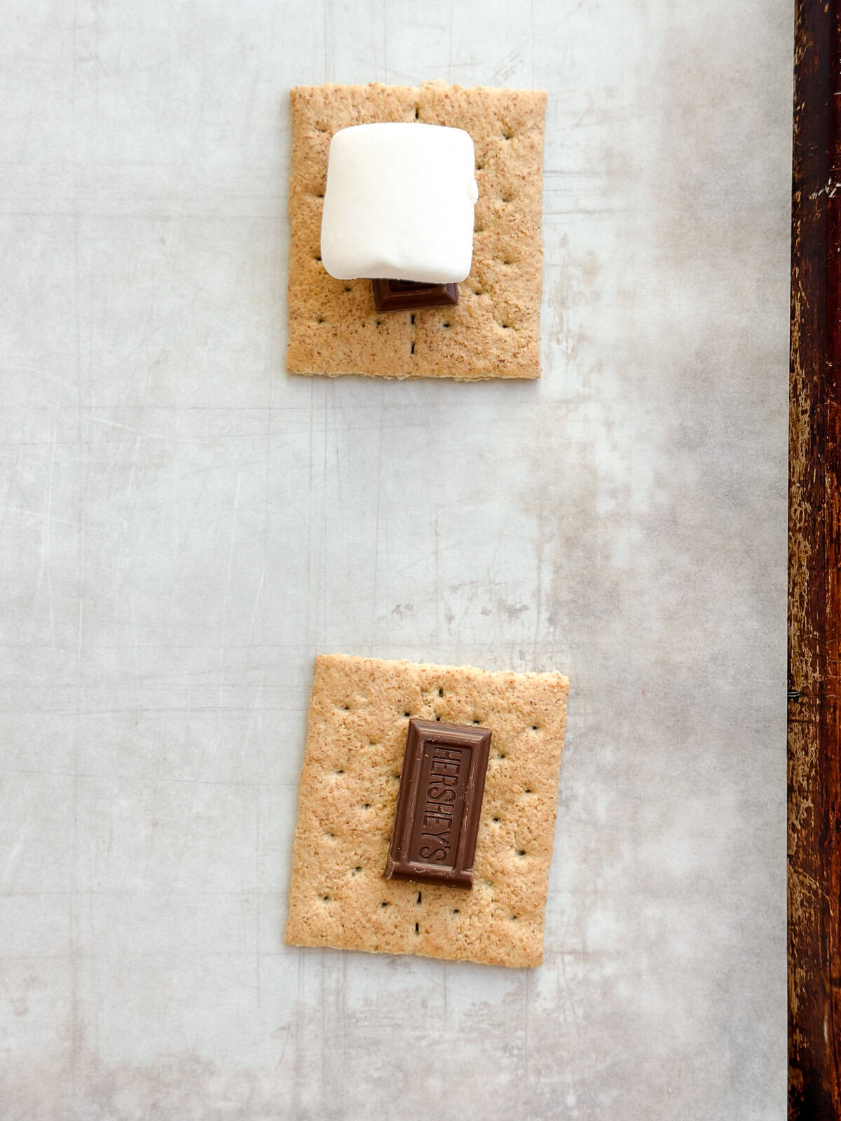 showing the graham cracker, chocolate and then marshmallow on top.