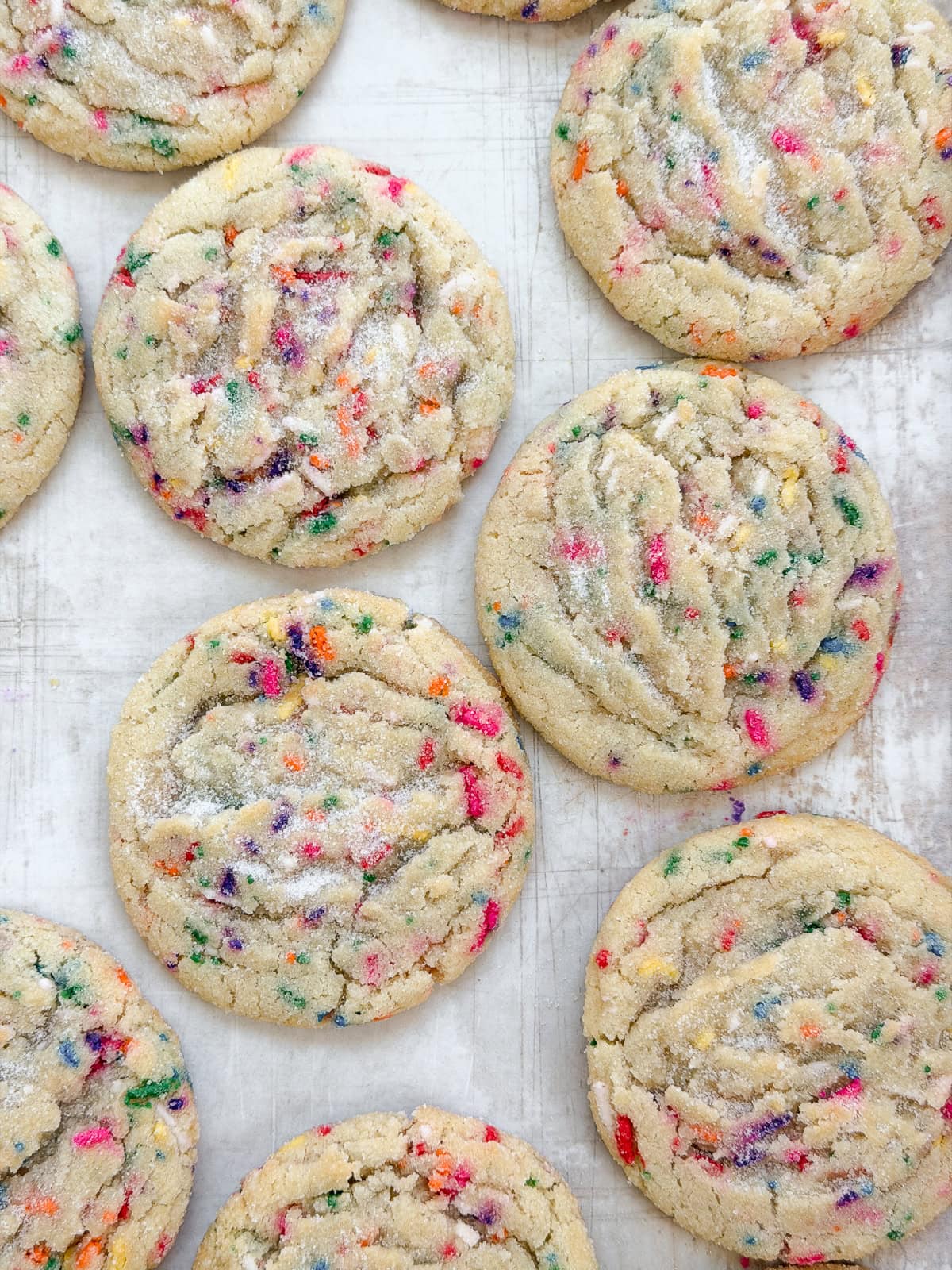 a few sprinkle sugar cookies staggered together.