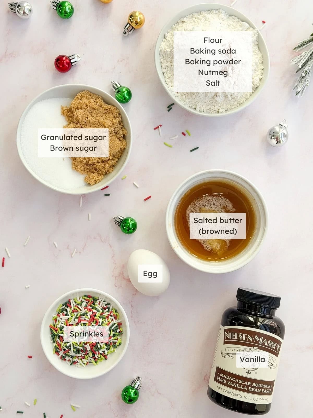 All of the ingredients needed to make Christmas sprinkle sugar cookies.