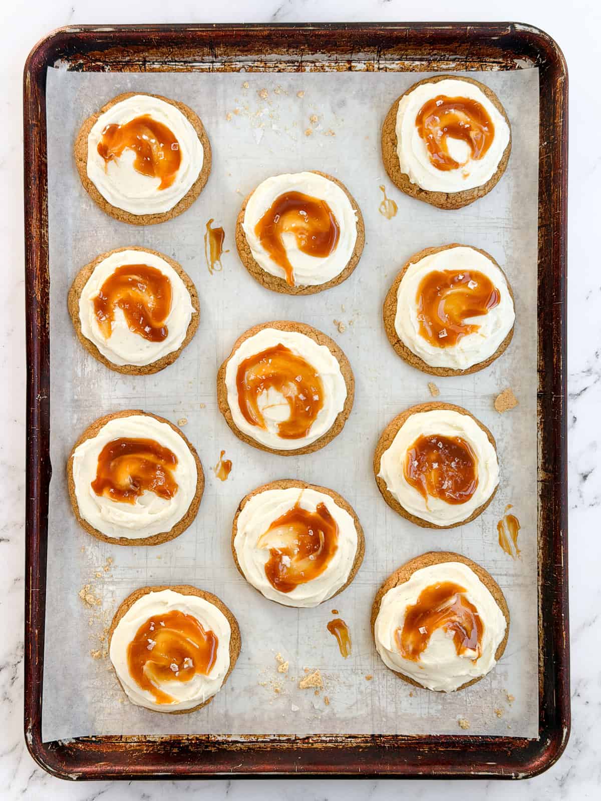 all the salted caramel cheesecake cookies on a baking sheet.