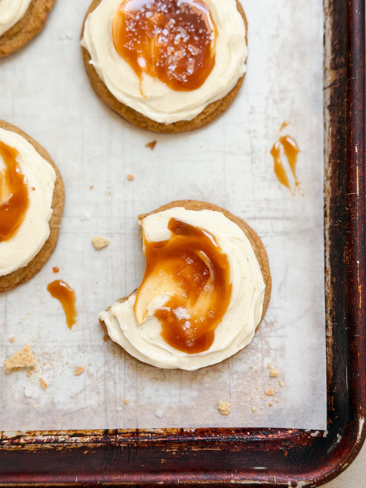 a salted caramel cheesecake cookie with a bite missing.